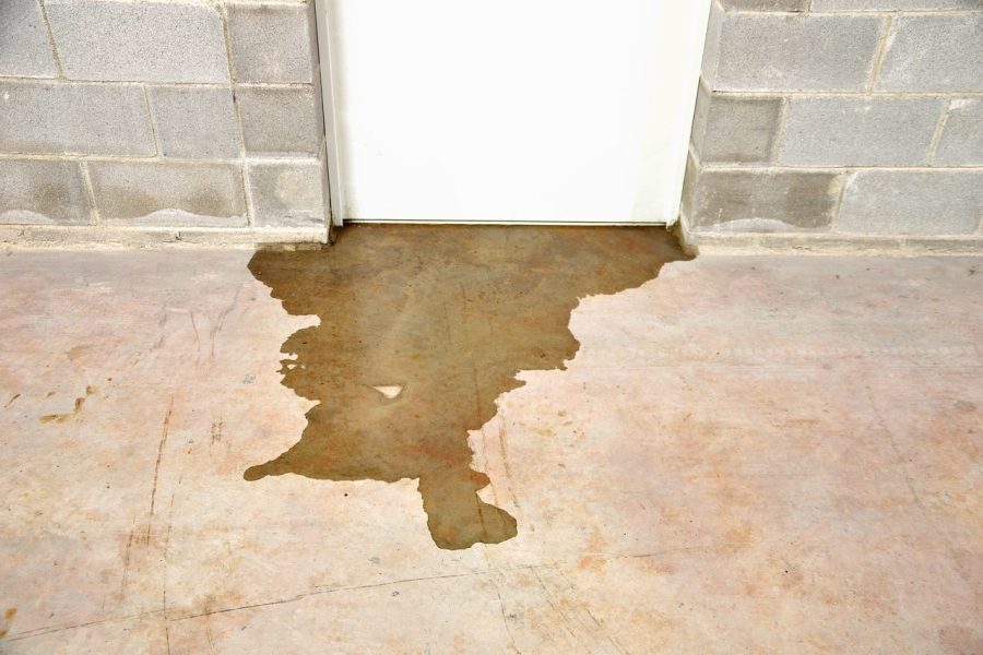 A leak of water flowing on the basement room floor