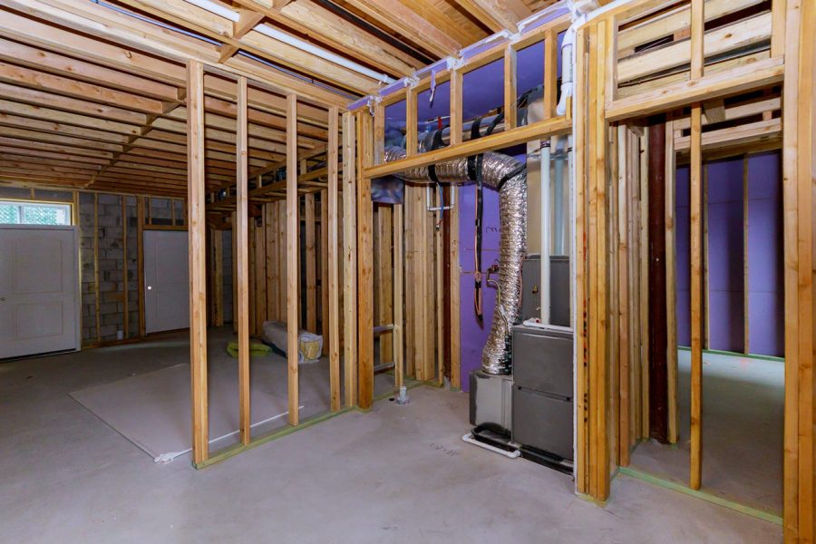 Basement reconstruction; interior structure shows wood framing and a heating system