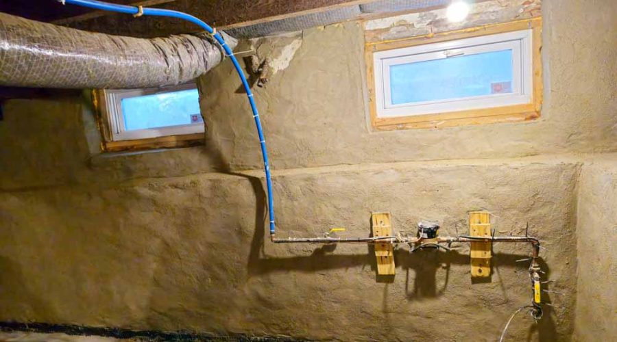 Concrete parging in basement interior wall for waterproofing and stronger foundation