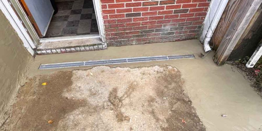 Trench Drain or grate drain installed in a house doorway